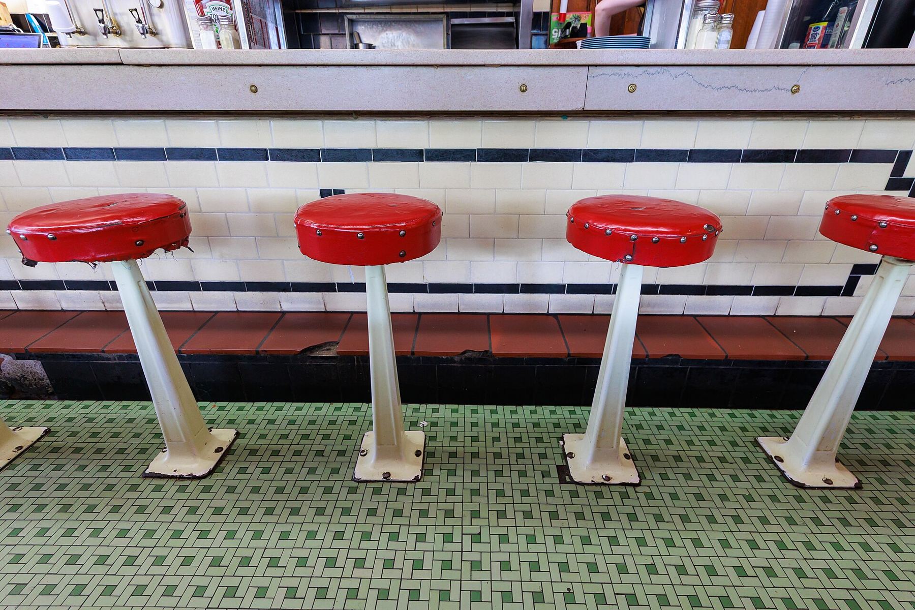 Red counter stools inside the Boulevard Diner on Shrewsbury Street
